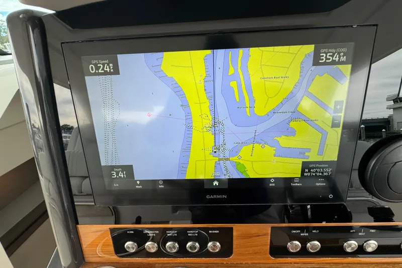 Slide: The Image of Garmin navigation display on 2023 Tiara Yachts 43 LS, showing nautical map and controls. - 51