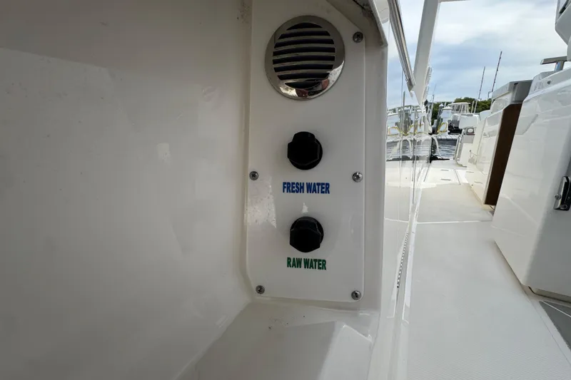 Slide: The Image of 2023 Tiara Yachts 43 LS water controls, featuring fresh and raw water options. - 59