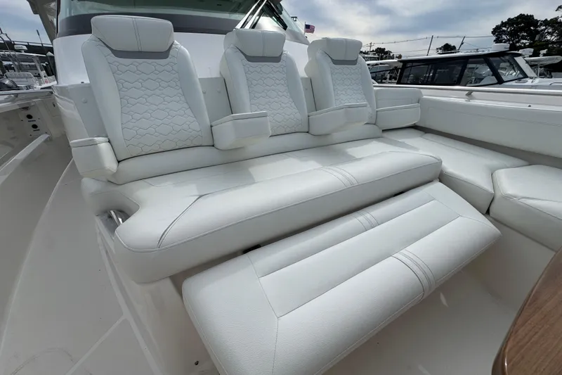Slide: The Image of 2023 Tiara Yachts 43 LS luxury seating with white upholstery and modern design. - 63