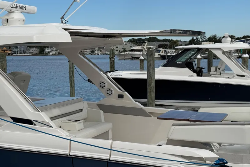Slide: The Image of 2023 Tiara Yachts 43 LS docked, showcasing sleek design and luxury features. - 7