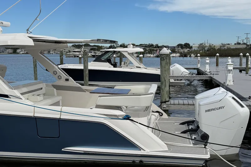 Slide: The Image of 2023 Tiara Yachts 43 LS docked with Mercury outboard engines. - 8