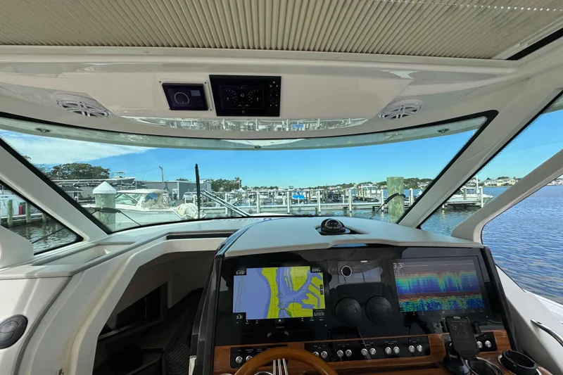 Slide: The Image of Interior view of 2023 Tiara Yachts 43 LS, featuring advanced navigation displays. - 84