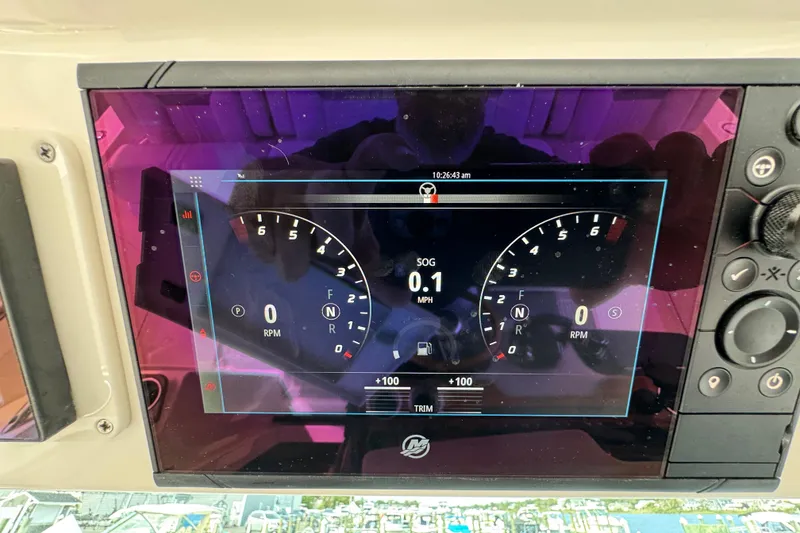 Slide: The Image of Dashboard of 2023 Tiara Yachts 43 LS showing speed and RPM gauges. - 87