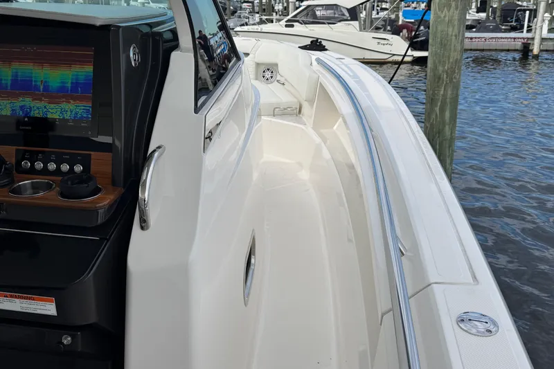 Slide: The Image of 2023 Tiara Yachts 43 LS boat with sleek design and advanced navigation system. - 98