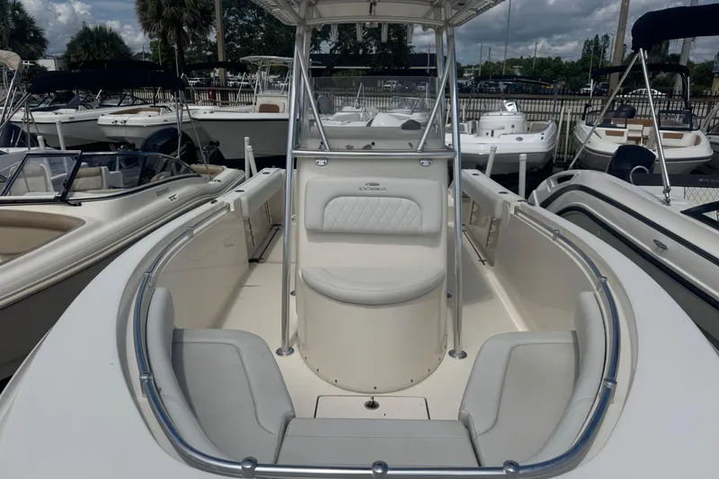 Slide: The Image of 2022 Cobia 237 Center Console boat with spacious seating and sleek design. - 5