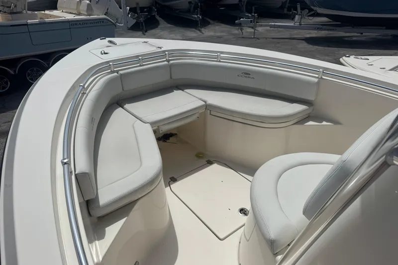 Slide: The Image of 2022 Cobia 237 Center Console boat with spacious seating area and sleek design. - 6