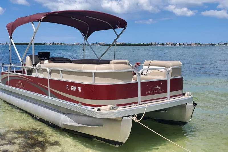 Slide: The Image of 2012 Bennington 22 SSI boat with Yamaha 115 engine, featuring a fishing seat and console. - 10