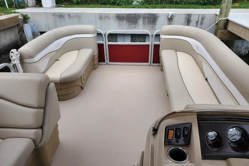 Slide: The Image of Red Bennington 22 SSI boat, model year 2012, with visible lettering. - 3