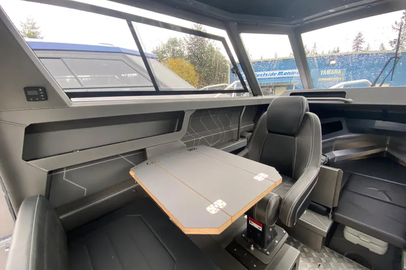 Slide: The Image of Interior of 2026 Stabicraft 2350 Supercab with table and seat. - 12