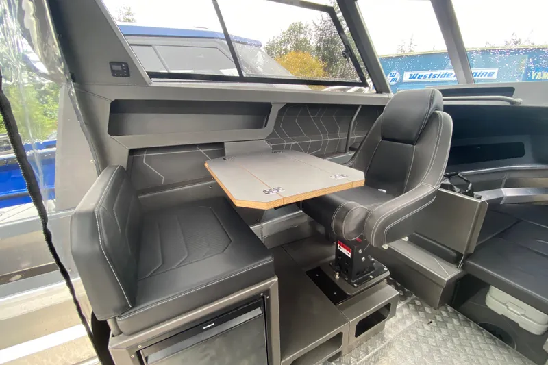 Slide: The Image of Interior of 2026 Stabicraft 2350 Supercab with seating and table. - 17