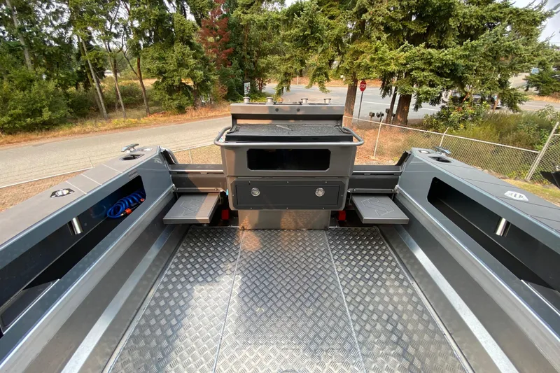 Slide: The Image of 2026 Stabicraft 2350 Supercab interior with aluminum flooring and storage compartments. - 3
