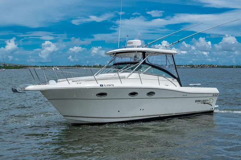 Slide: The Image of 2002 Sport-Craft 3150 Sportfish boat cruising on a sunny day. - 2