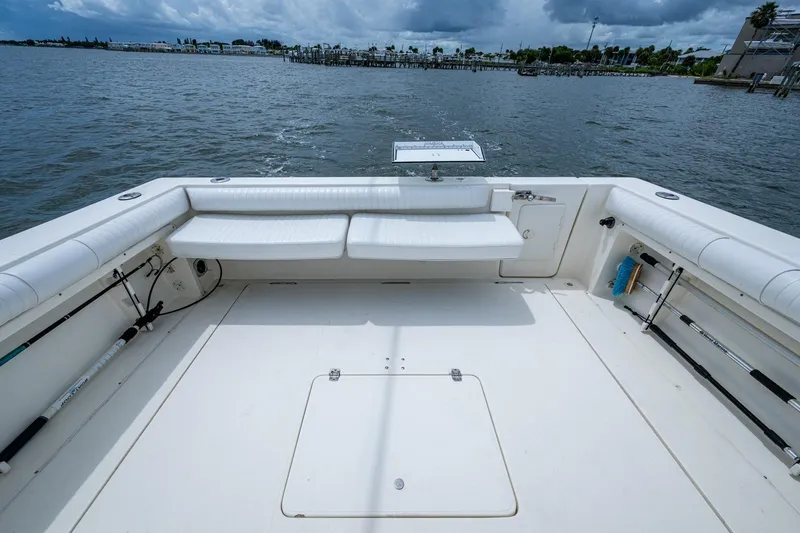 Slide: The Image of 2002 Sport-Craft 3150 Sportfish boat deck with seating, overlooking calm waters. - 30