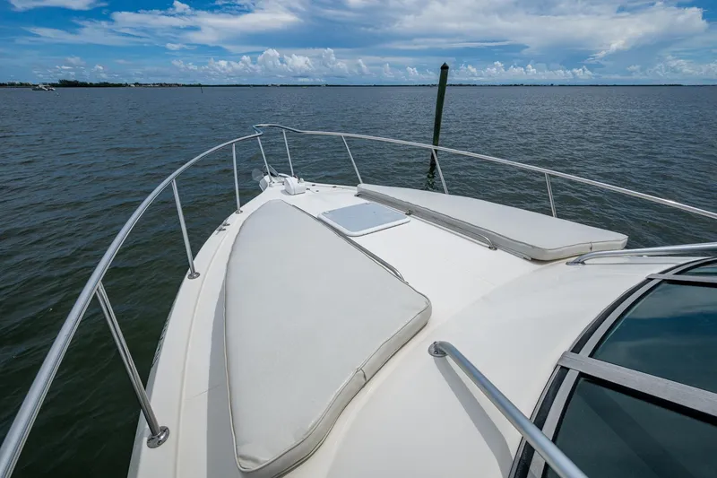 Slide: The Image of 2002 Sport-Craft 3150 Sportfish boat deck with cushions on open water. - 32