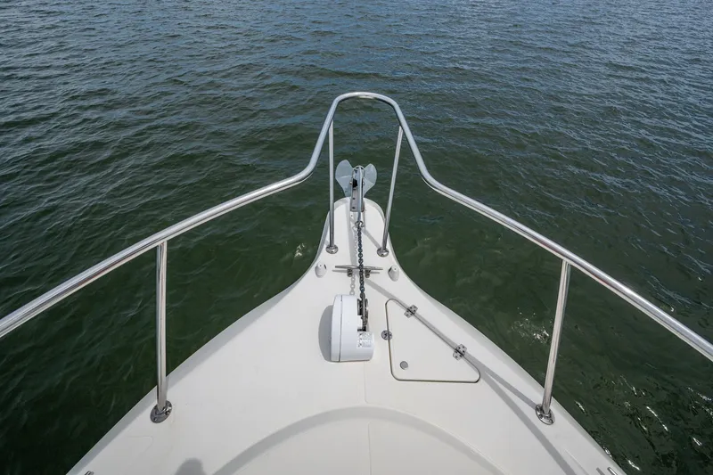 Slide: The Image of Bow view of 2002 Sport-Craft 3150 Sportfish boat on water. - 34