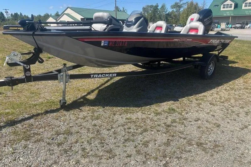 The Image of 2017 Tracker Pro Team 175 TXW boat on trailer, parked outdoors. - 1
