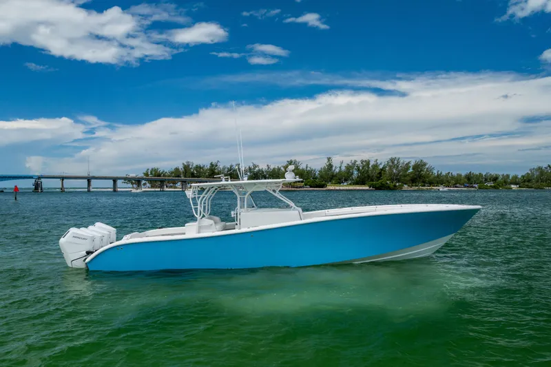 The Image of 2009 Yellowfin 42 Offshore boat on calm water under a blue sky. - 1