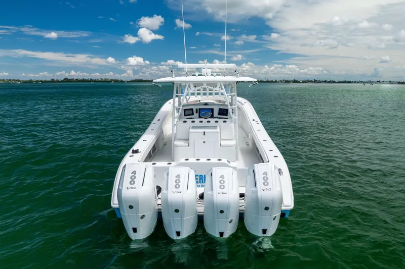 Slide: The Image of 2009 Yellowfin 42 Offshore boat with four powerful engines on open water. - 11