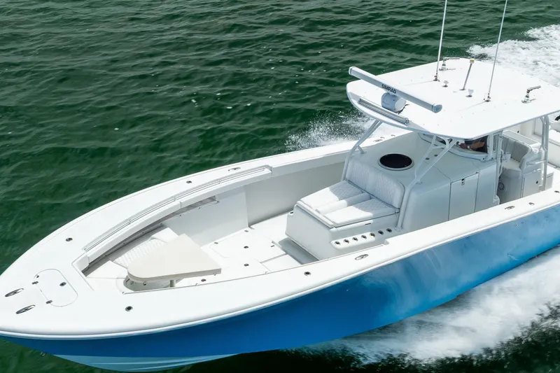 Slide: The Image of 2009 Yellowfin 42 Offshore boat cruising on open water, showcasing sleek design and performance. - 23