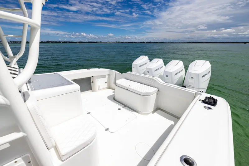 Slide: The Image of 2009 Yellowfin 42 Offshore boat with quad Mercury engines on open water. - 28