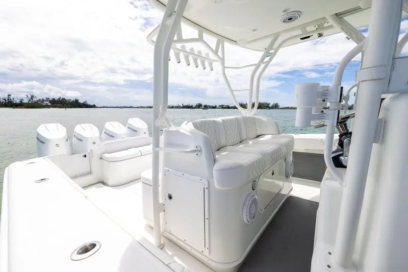 Slide: The Image of 2009 Yellowfin 42 Offshore boat interior with seating and multiple outboard engines. - 38