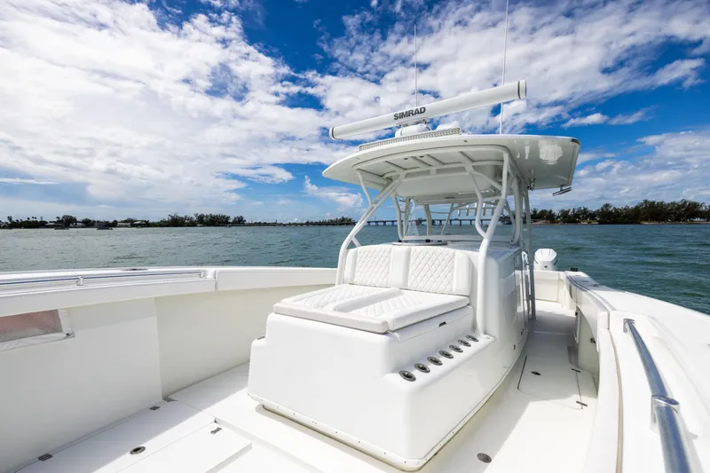Slide: The Image of 2009 Yellowfin 42 Offshore boat on water under blue sky. - 46