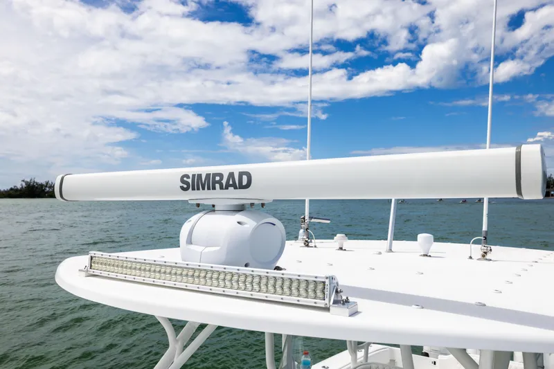 Slide: The Image of Radar equipment on 2009 Yellowfin 42 Offshore boat under blue sky. - 47