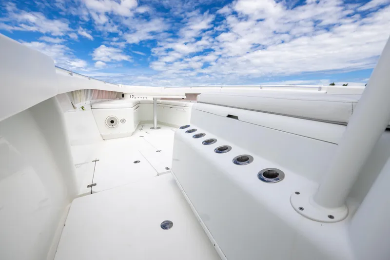 Slide: The Image of 2009 Yellowfin 42 Offshore boat deck under a blue sky with clouds. - 48