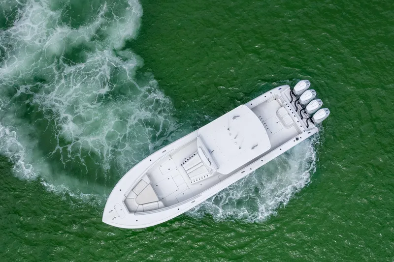 Slide: The Image of Aerial view of 2009 Yellowfin 42 Offshore boat cruising in green waters. - 9