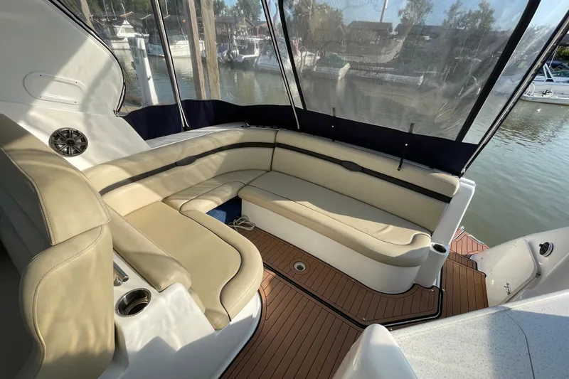 Slide: The Image of 2019 Rinker 370 EX boat cockpit with steering wheel and control panel. - 12