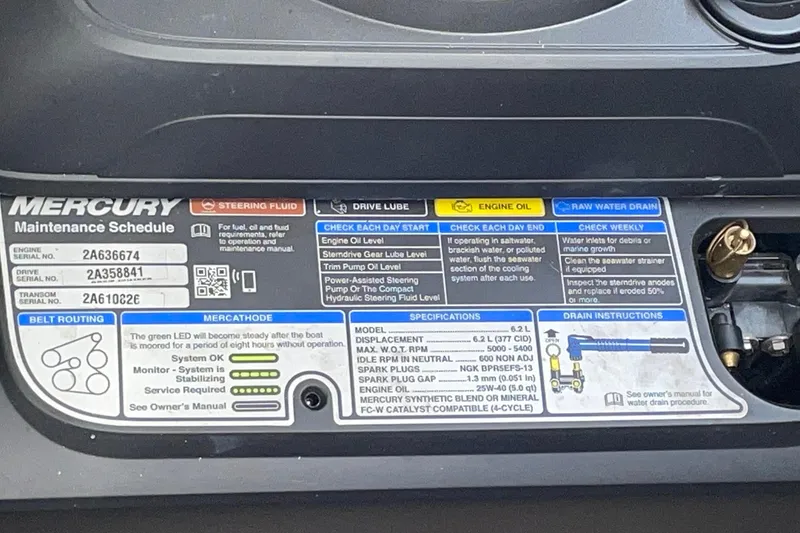 Slide: The Image of Mercury maintenance schedule label on a 2019 Rinker 370 EX boat engine. - 32