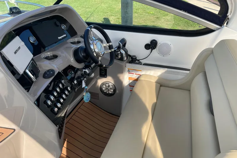 Slide: The Image of 2019 Rinker 370 EX boat on stands, rear view, in a boatyard. - 6