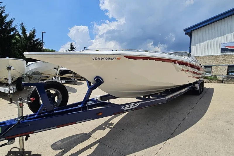 Slide: The Image of 2007 Fountain 42 Lightning boat on trailer under a partly cloudy sky. - 12