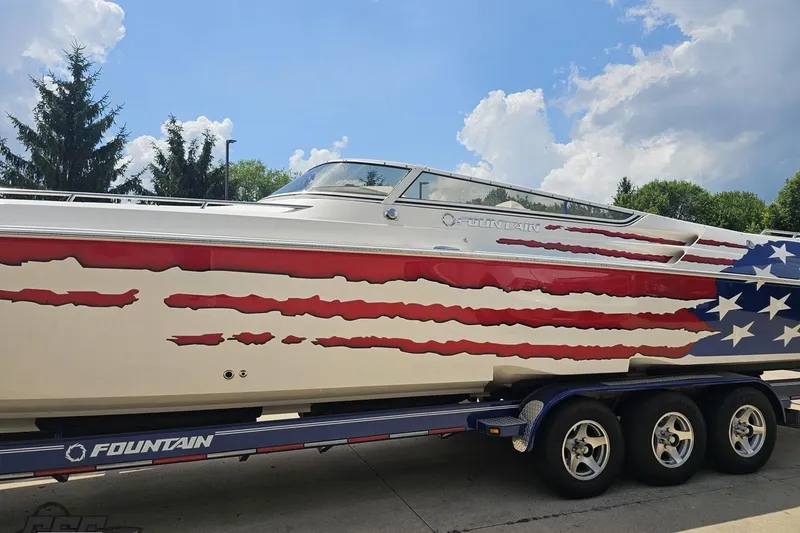 Slide: The Image of 2007 Fountain 42 Lightning boat with American flag design on trailer. - 16