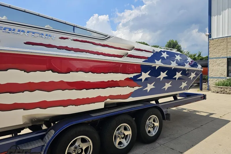 Slide: The Image of 2007 Fountain 42 Lightning boat with American flag design on trailer. - 17