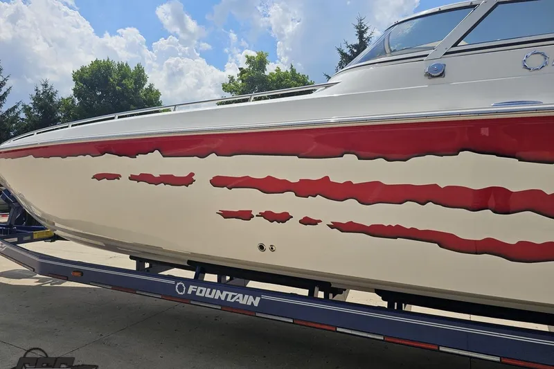 Slide: The Image of 2007 Fountain 42 Lightning boat with red and white design on trailer. - 19
