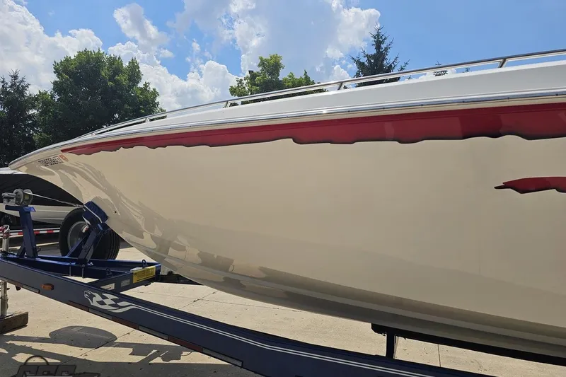 Slide: The Image of 2007 Fountain 42 Lightning boat on trailer under a clear blue sky. - 20