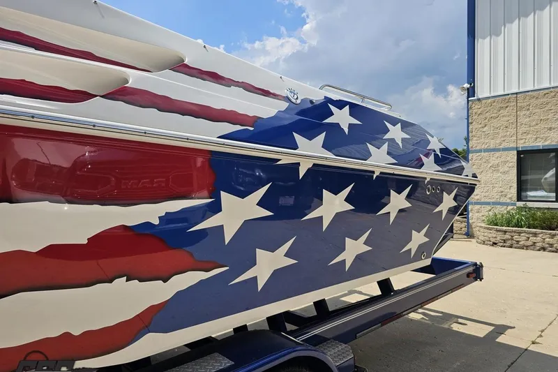 Slide: The Image of 2007 Fountain 42 Lightning boat with American flag design on trailer. - 22