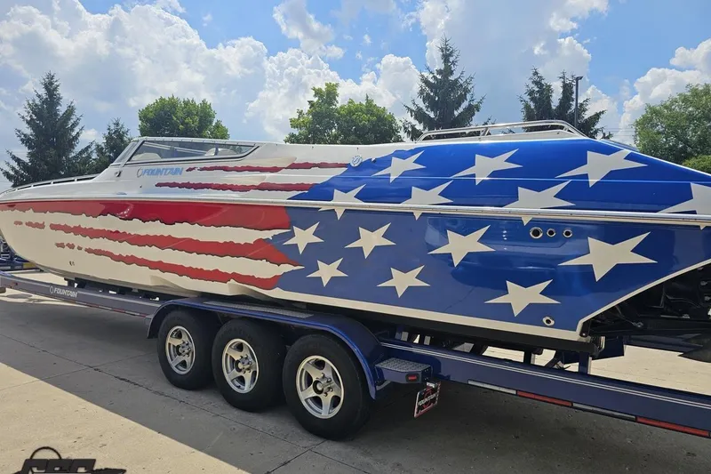 Slide: The Image of 2007 Fountain 42 Lightning boat with American flag design on trailer. - 24