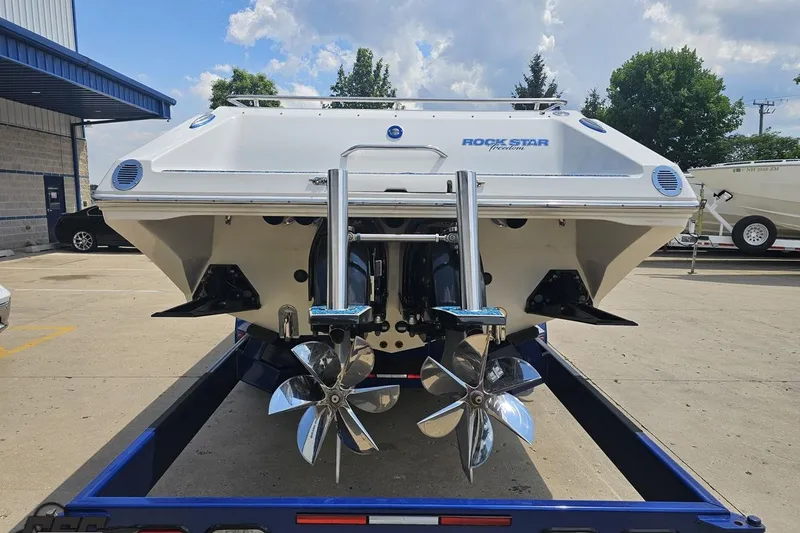 Slide: The Image of 2007 Fountain 42 Lightning boat on trailer, rear view with dual propellers. - 28