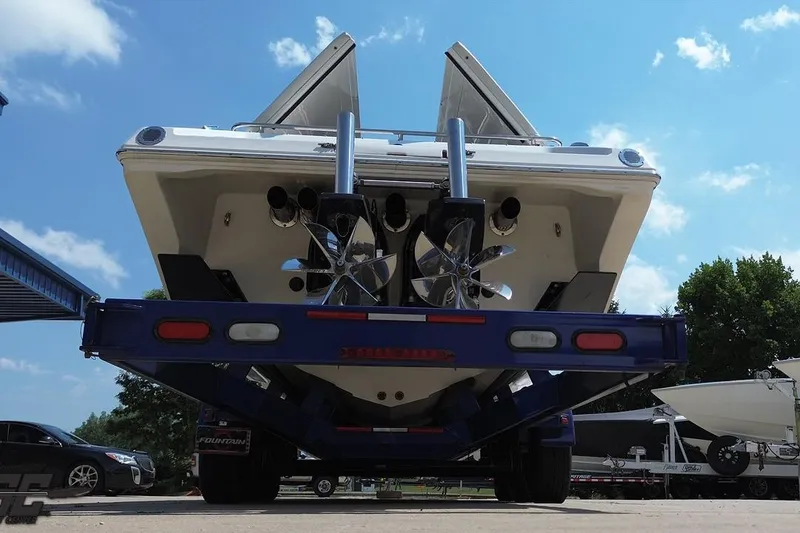 Slide: The Image of Rear view of a 2007 Fountain 42 Lightning boat on a trailer under a blue sky. - 33