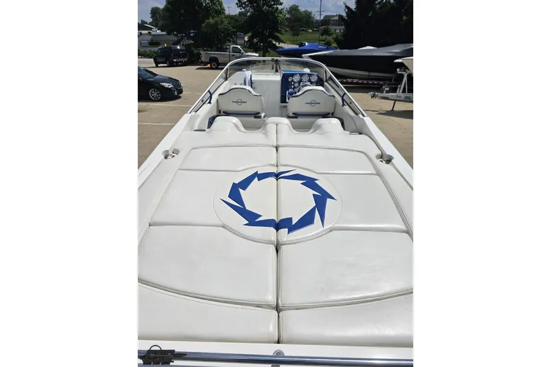 Slide: The Image of 2007 Fountain 42 Lightning boat with white seating and blue logo on deck. - 37
