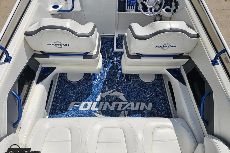 Slide: The Image of Interior of 2007 Fountain 42 Lightning boat with white seating and blue accents. - 43