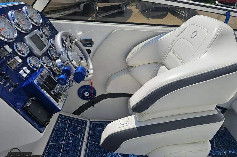 Slide: The Image of Cockpit of 2007 Fountain 42 Lightning boat with gauges and white leather seat. - 54