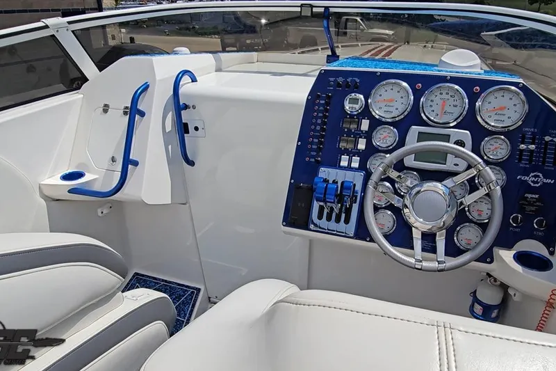 Slide: The Image of 2007 Fountain 42 Lightning boat cockpit with steering wheel and instrument panel. - 56