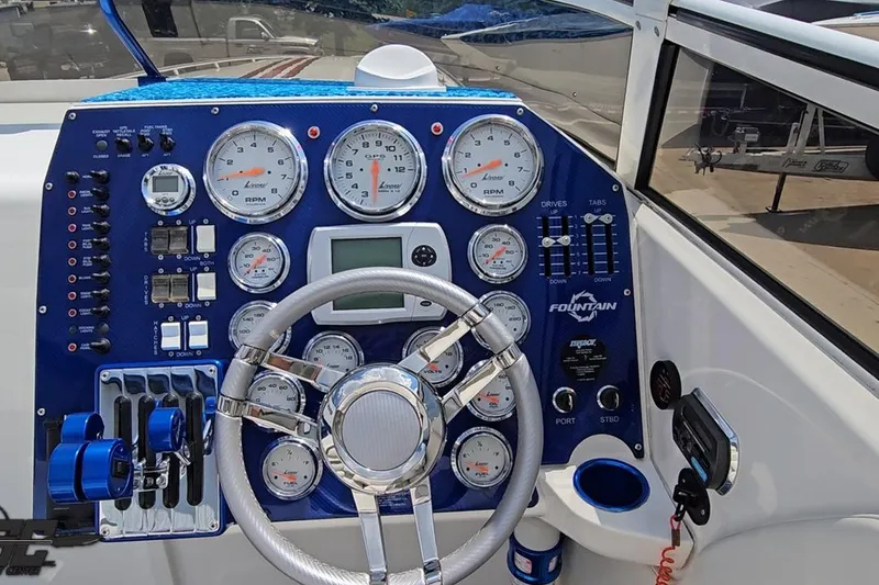 Slide: The Image of Dashboard of a 2007 Fountain 42 Lightning boat with gauges and controls. - 57