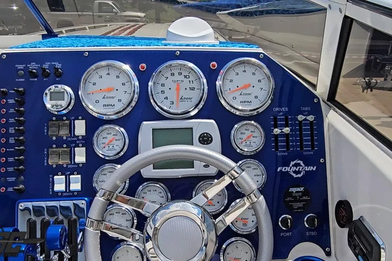 Slide: The Image of Dashboard of a 2007 Fountain 42 Lightning boat with gauges and controls. - 58