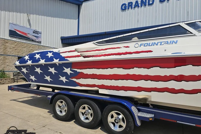 Slide: The Image of 2007 Fountain 42 Lightning boat with American flag design on trailer. - 6