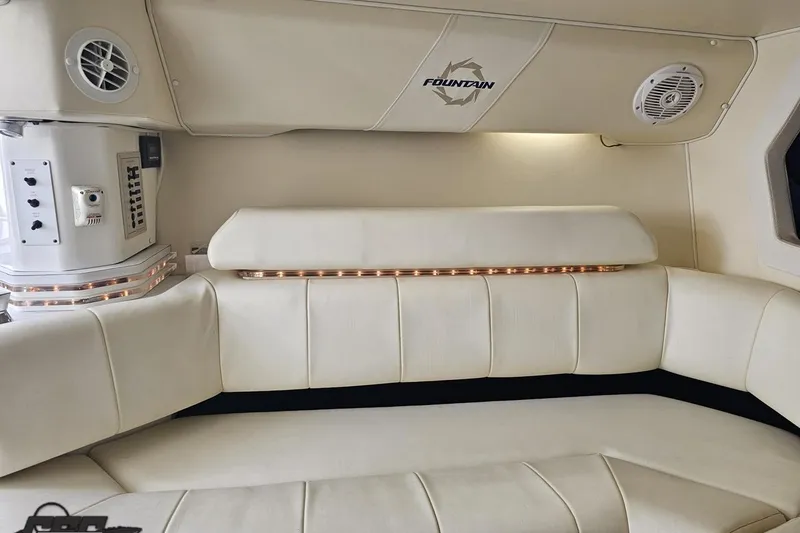Slide: The Image of Interior of 2007 Fountain 42 Lightning boat with white leather seating and ambient lighting. - 72