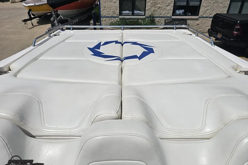 Slide: The Image of 2007 Fountain 42 Lightning boat with white cushioned deck and blue logo. - 85